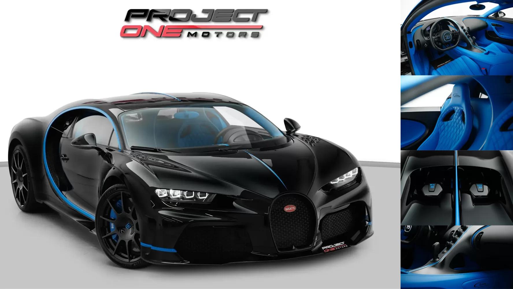 A Bugatti Chiron Supersport photographed at dawn in a Dubai showroom, held against near-black.